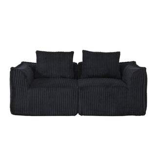 Minimalist Sofa With Curved Lines And Horn Shaped Throw Pillows