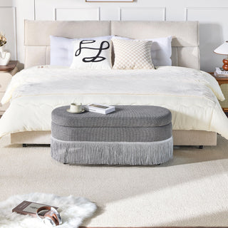 Oval Upholstered Storage Ottoman With Fringe Trim & Lift Top Lid
