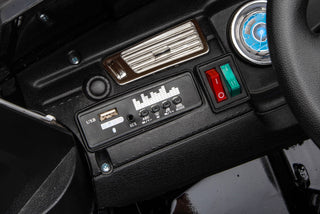 12V7A 30W*2 Four-Wheel Drive Seat One Button Start, Forward And Backward, High And Low Speed, Music, Front Light, Power Display, Two Doors Can Open, 2.4G R / C, Seat Belt Four Wheel Absorber