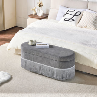 Oval Upholstered Storage Ottoman With Fringe Trim & Lift Top Lid